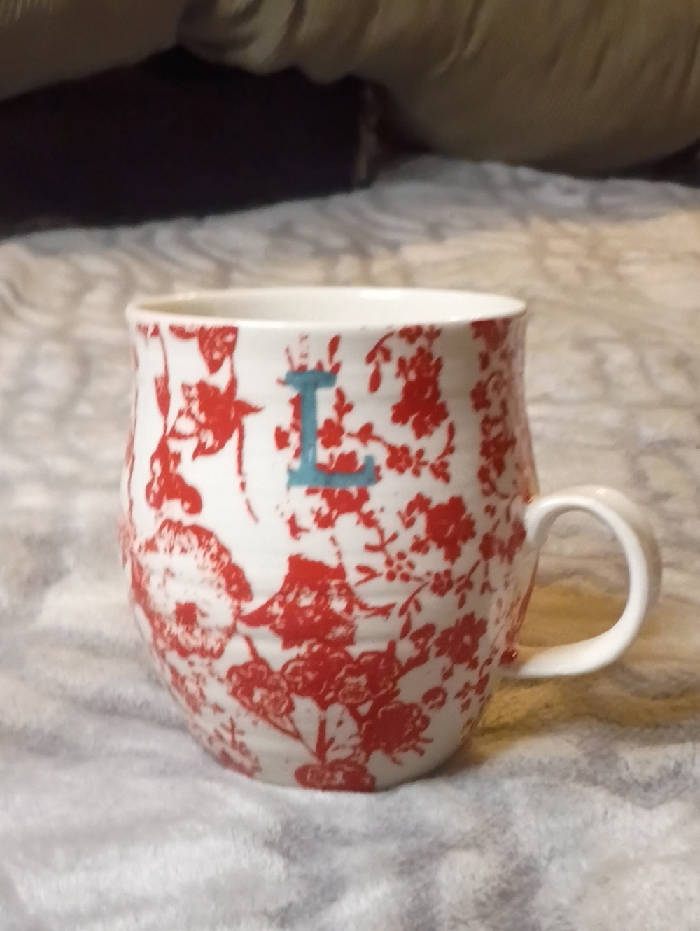 Anthropologue Homegrown Coffee Mug Features A Red Floral Pattern